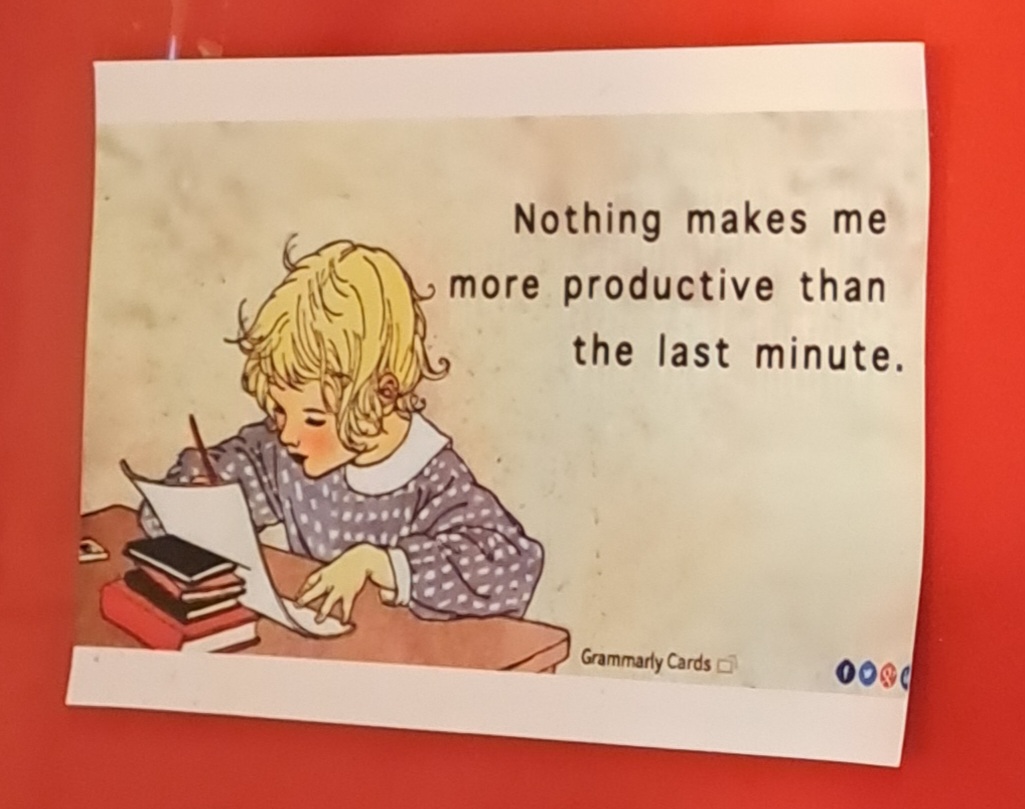 postcard of girl writing with caption "Nothering makes me more productive than the last minute"