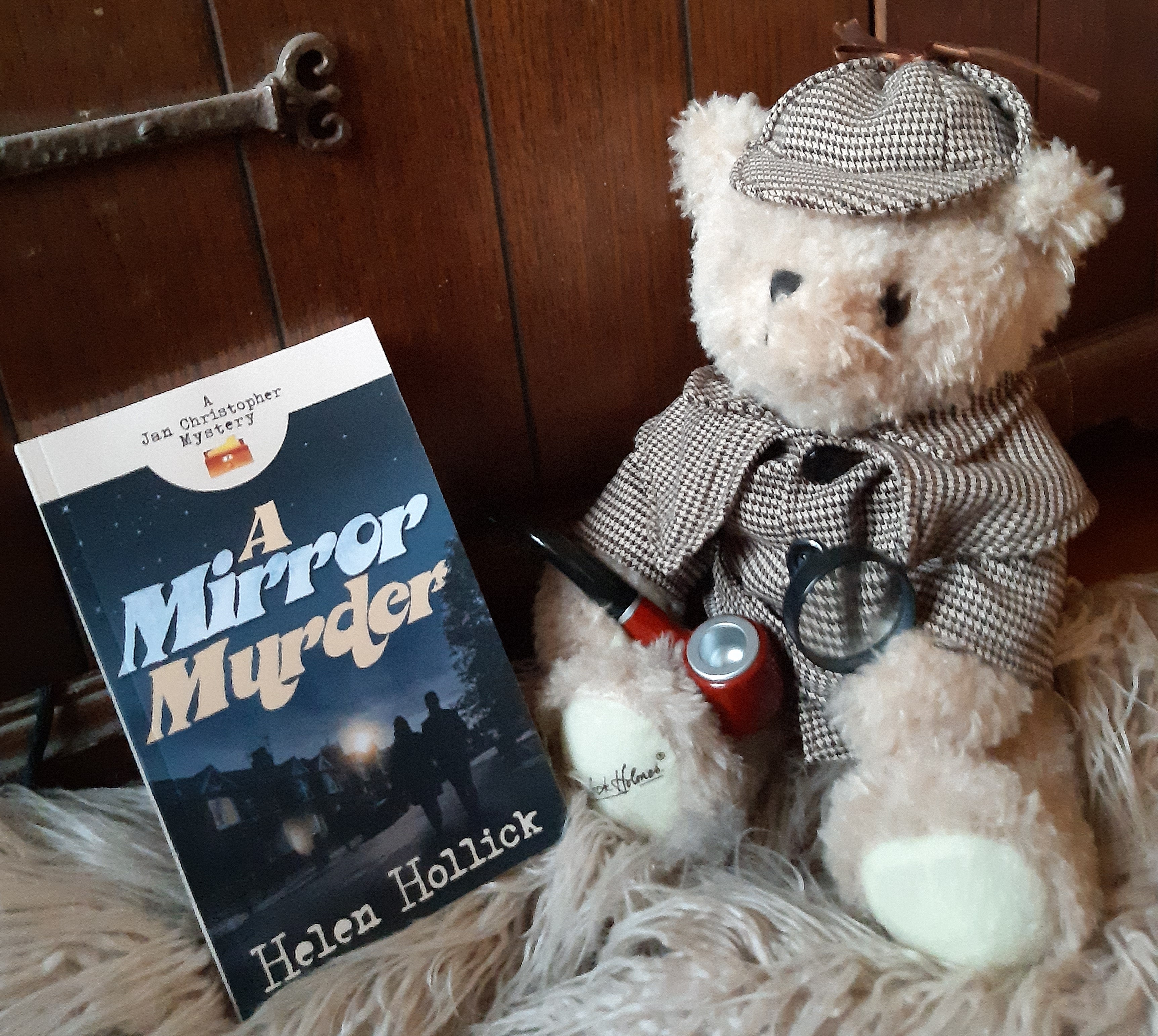 Image of "A Mirror Murder" with Sherlock Holmes teddy bear