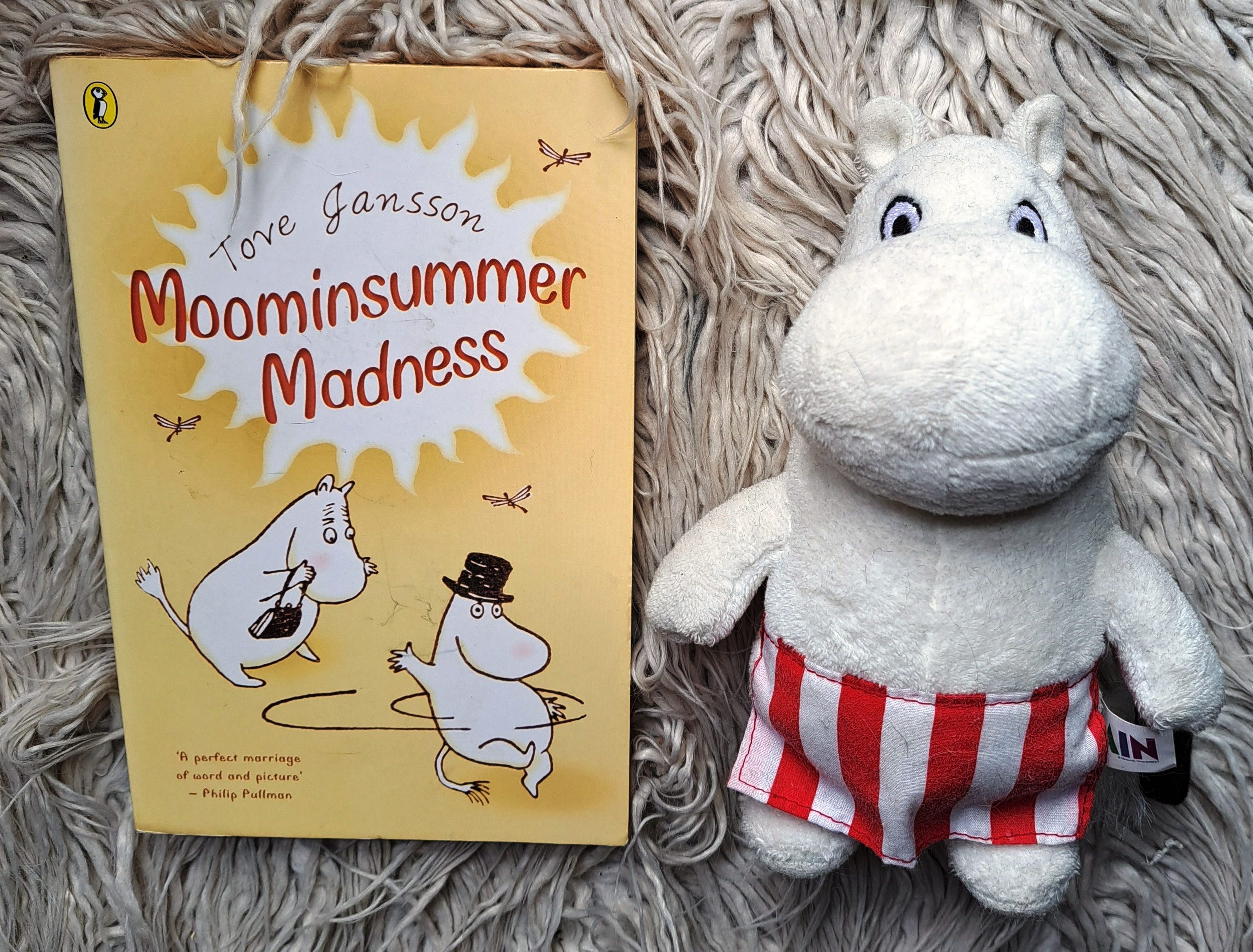 copy of Tove Jansson's Moominsummer Madness and a cuddly toy Moominmamma