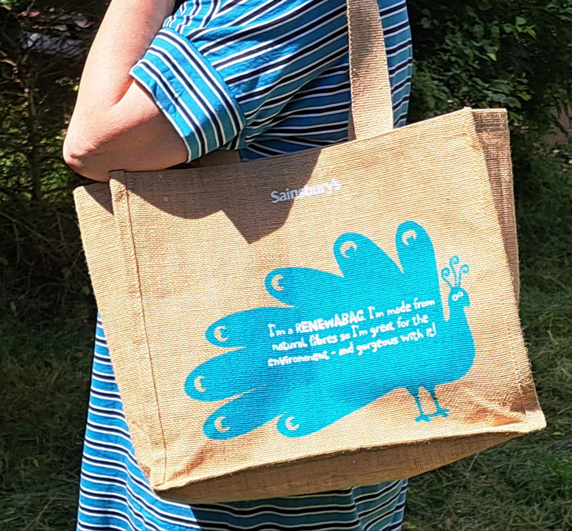 photo of Sainsbury's carrier bag with caption promoting recycling and picture of a peacock