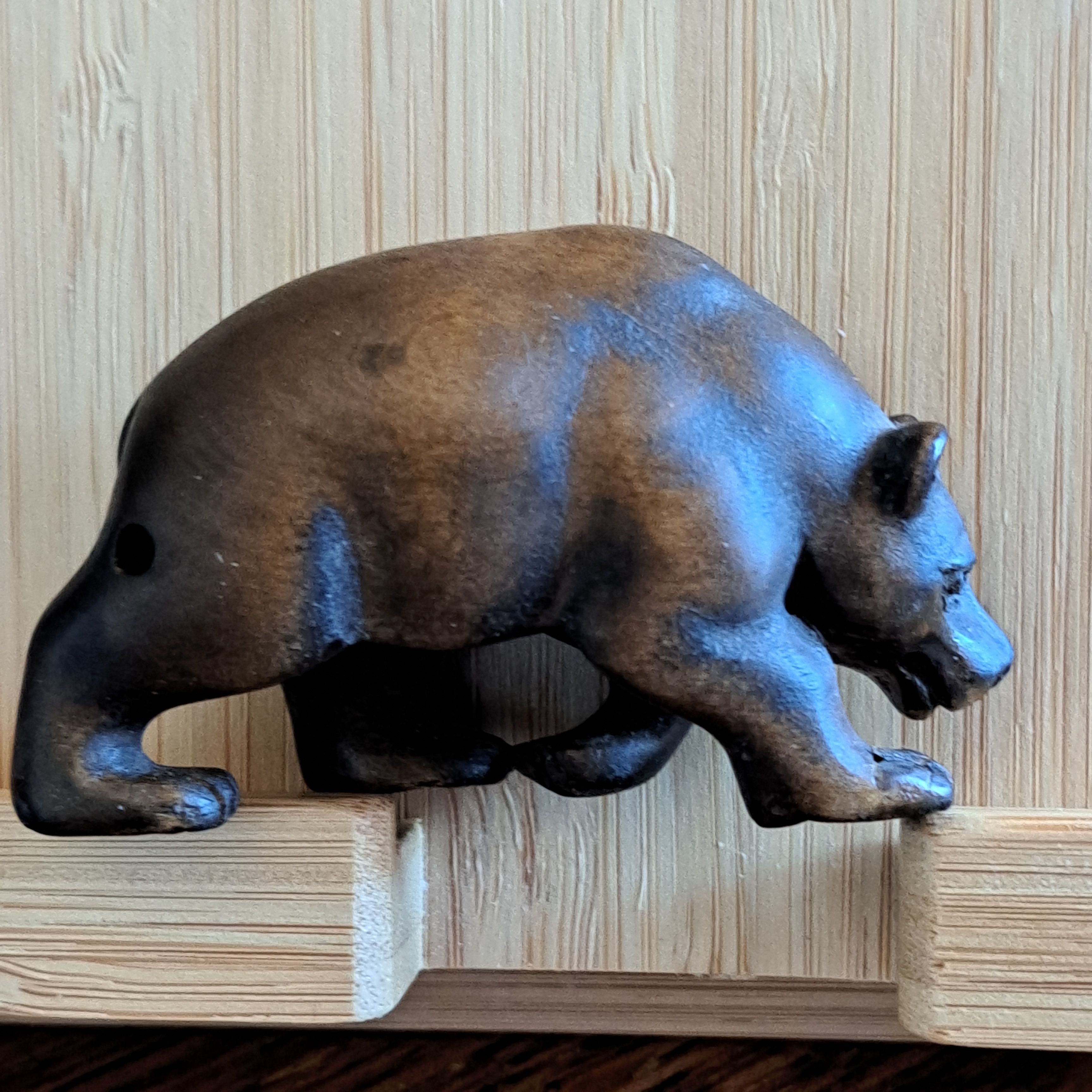 photo of small wooden reproduction netsuke bear