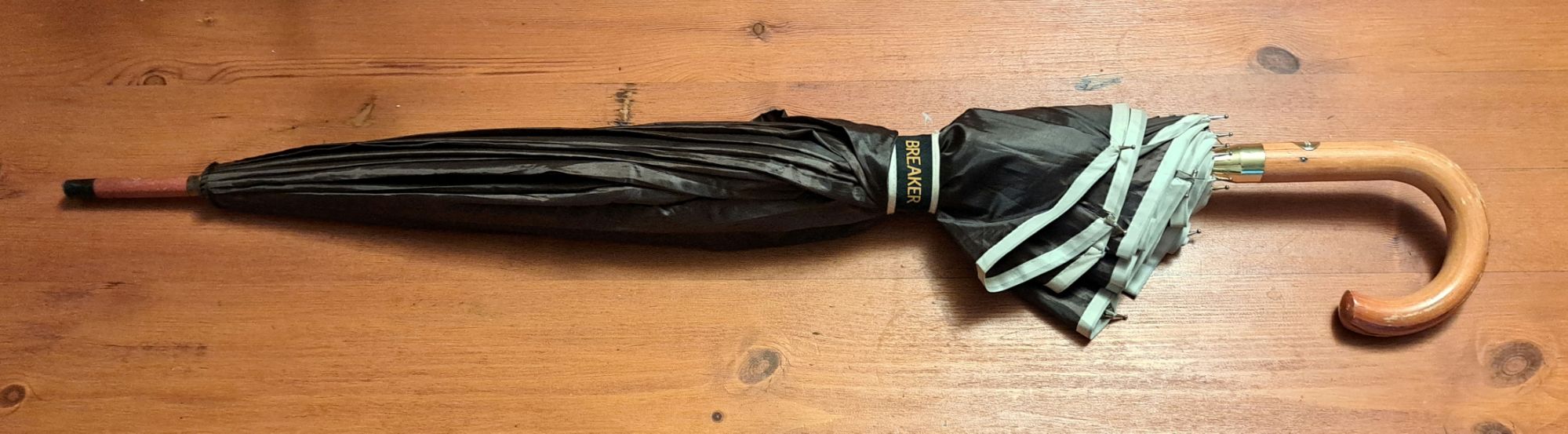 furled umbrella on table