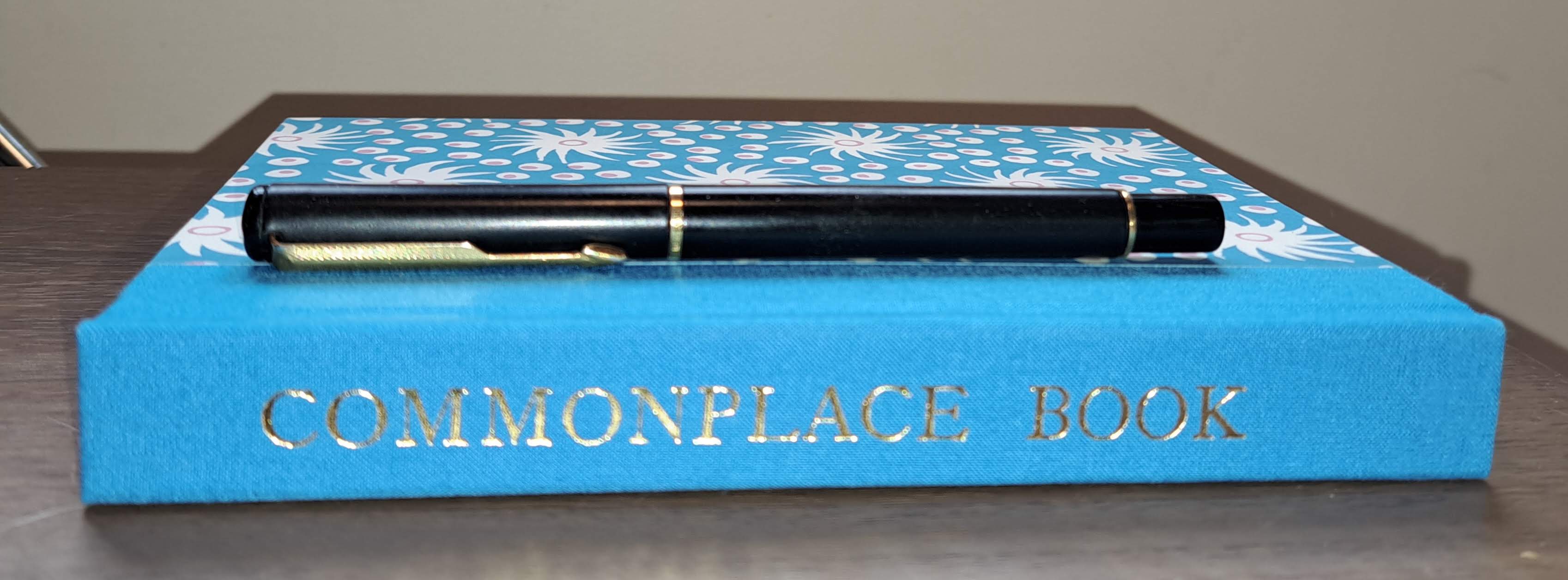 spine of my new commonplace book with a black Parker fountain pen