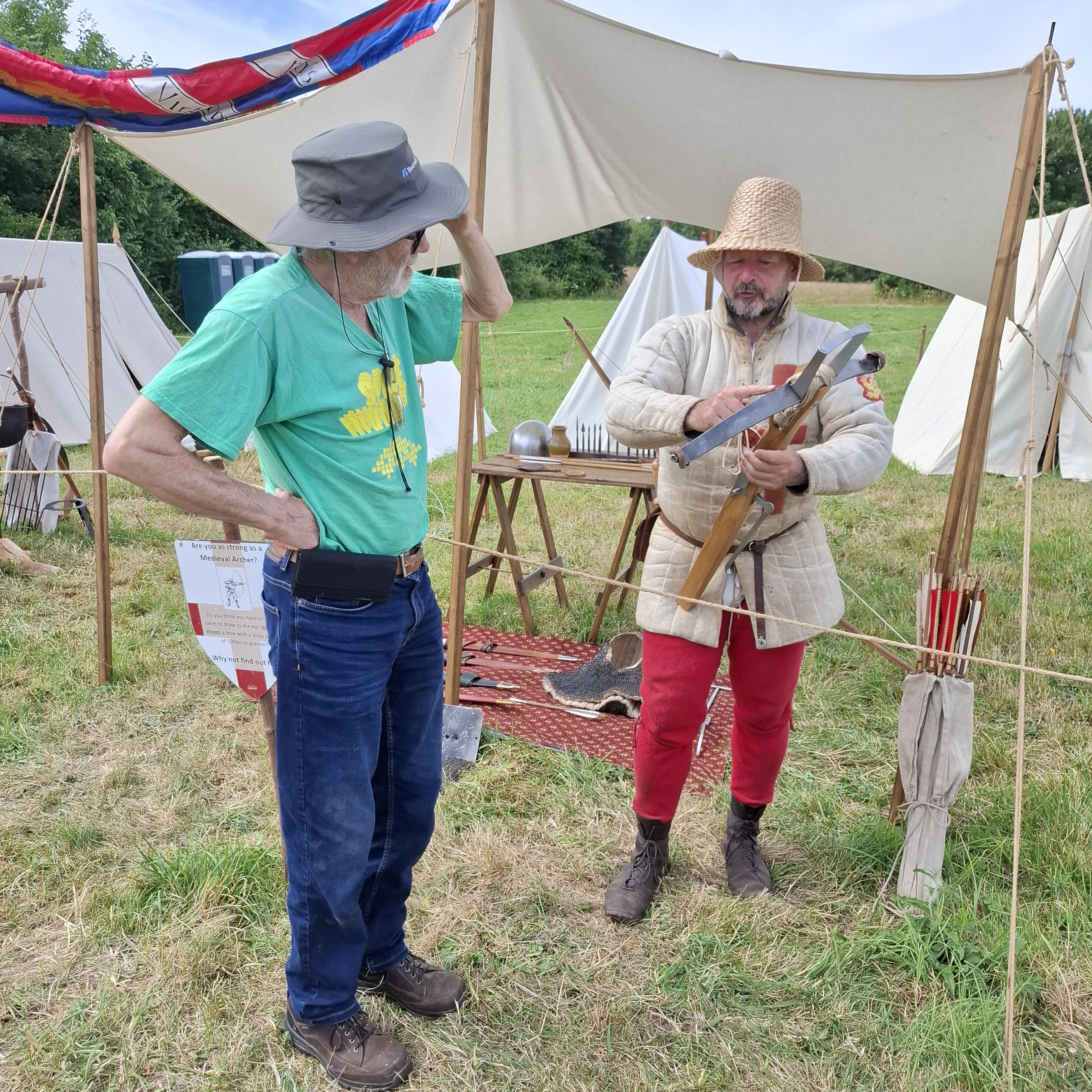 medieval archer shows off crossbow to my husband
